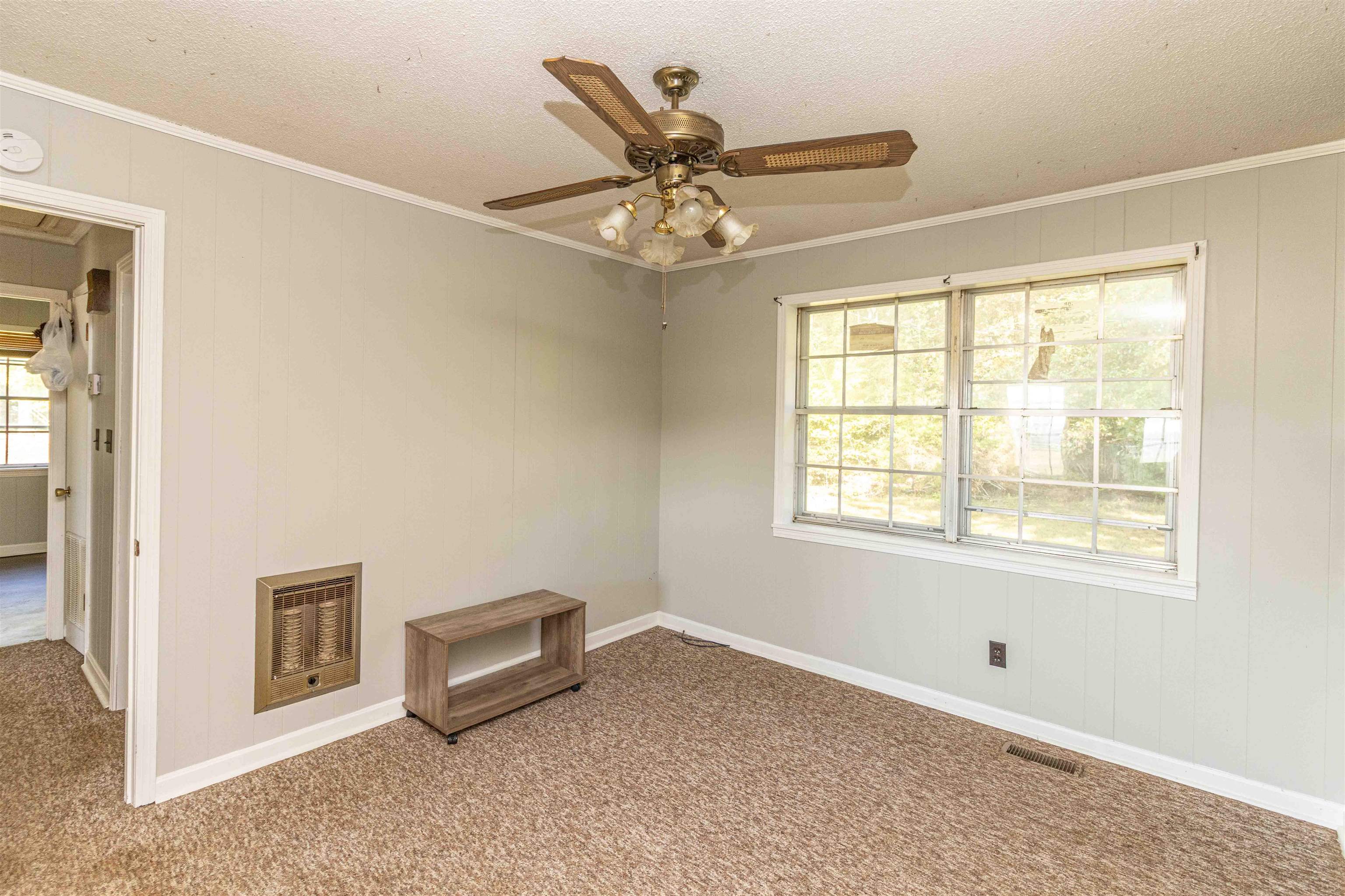 147 Jones Street Selmer, TN 38375 - Photo 10 of 19 a living room with furniture and a window