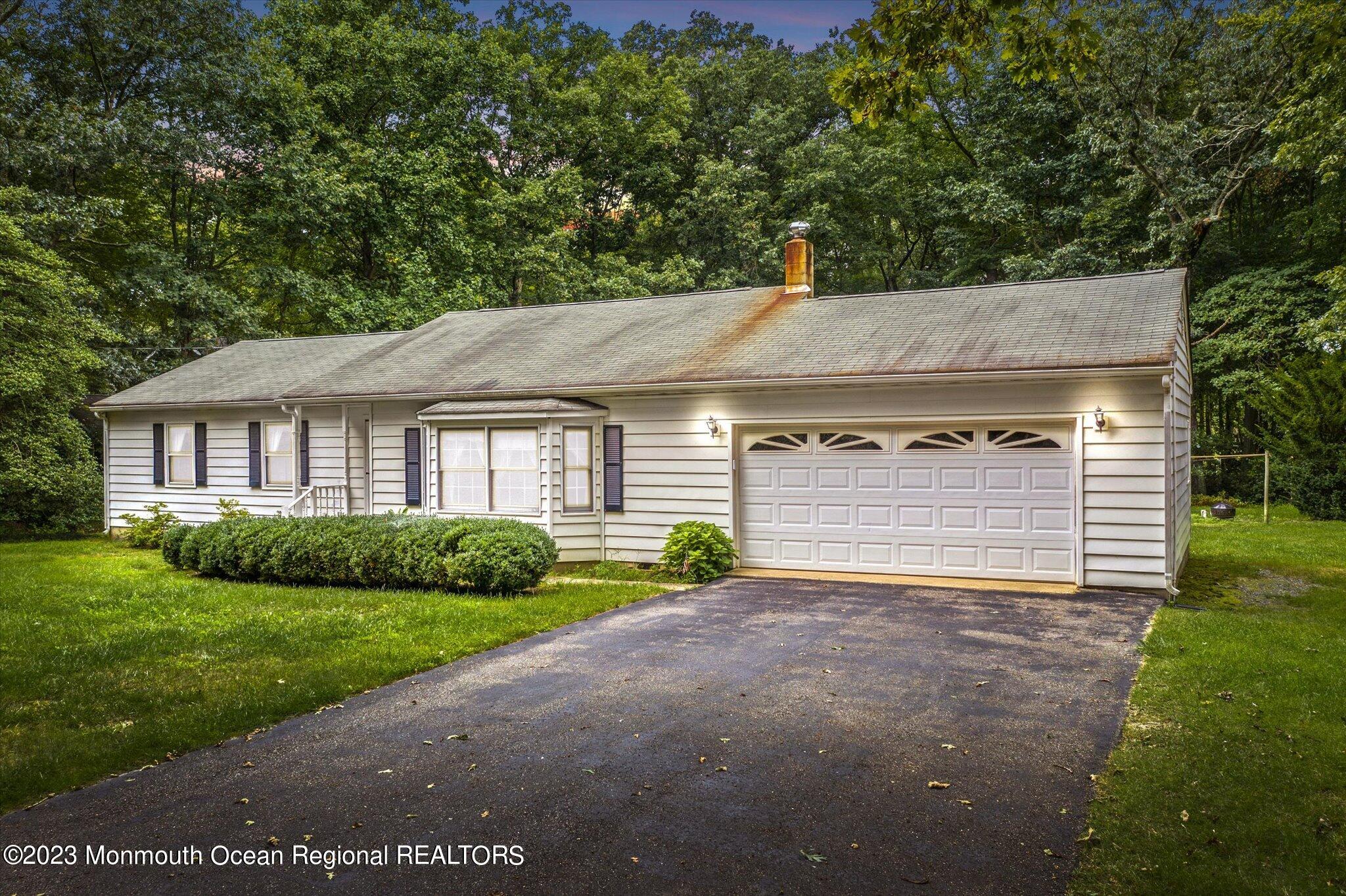 201 West Millstream Road Cream Ridge, NJ 08514 - Photo 1 of 41 a view of a house with a yard and garage