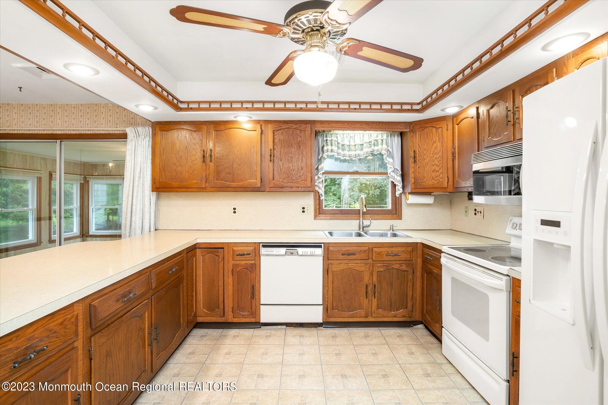 201 West Millstream Road Cream Ridge, NJ 08514 - Photo 15 of 41 a large kitchen with stainless steel appliances granite countertop a sink and cabinets