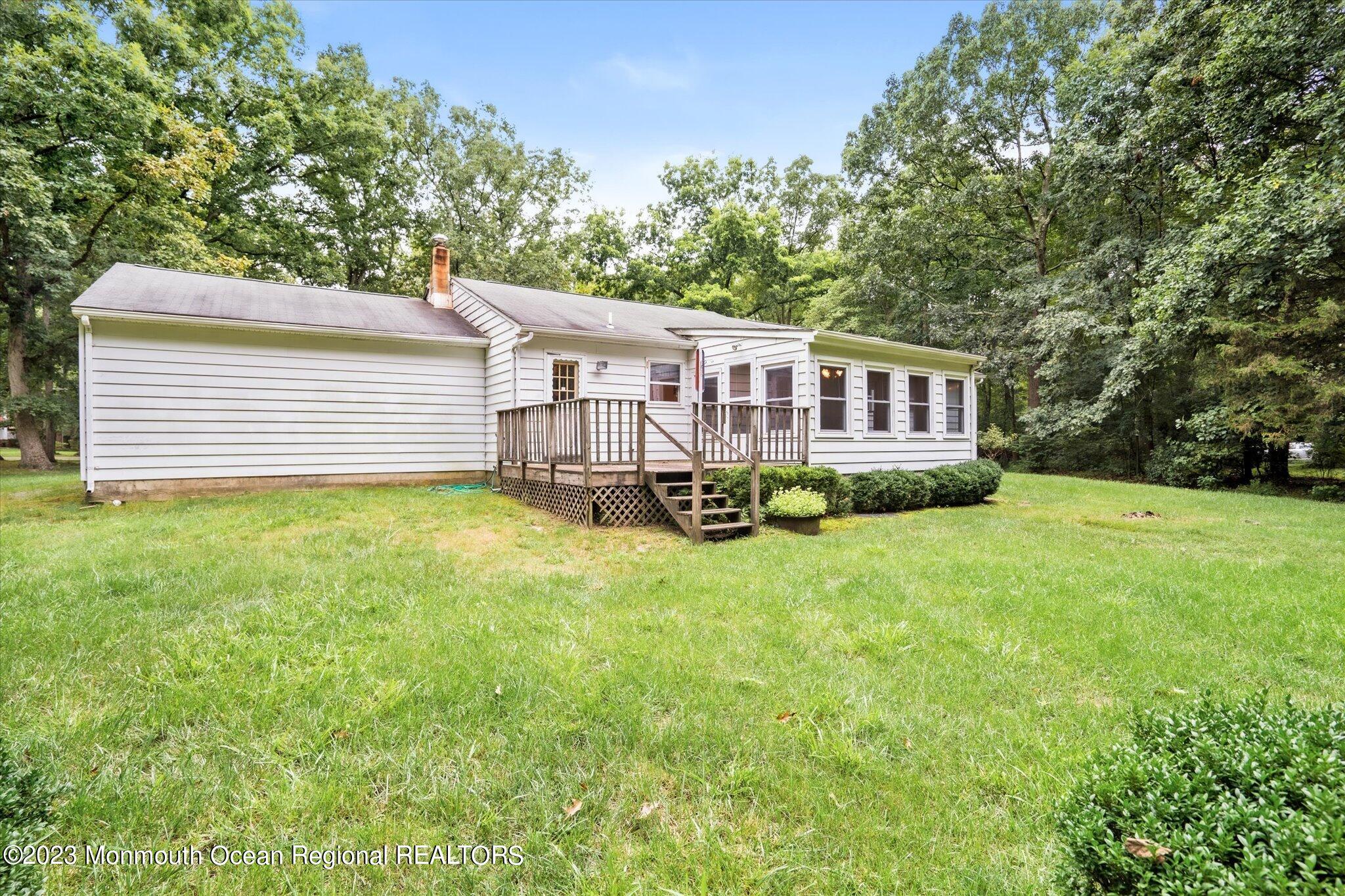 201 West Millstream Road Cream Ridge, NJ 08514 - Photo 32 of 41 a view of a house with backyard and a sitting area