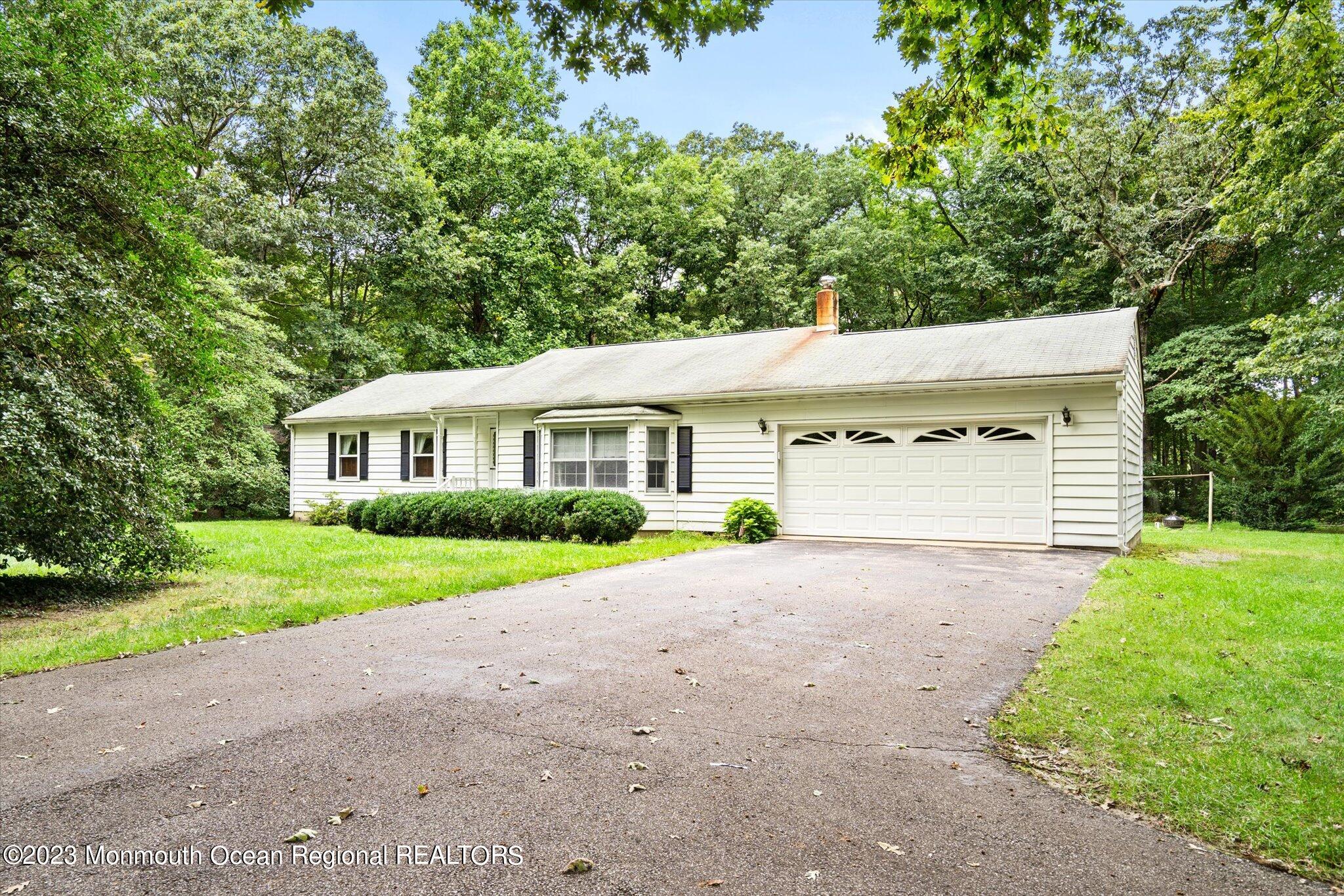 201 West Millstream Road Cream Ridge, NJ 08514 - Photo 6 of 41 a view of a house with a yard and large trees
