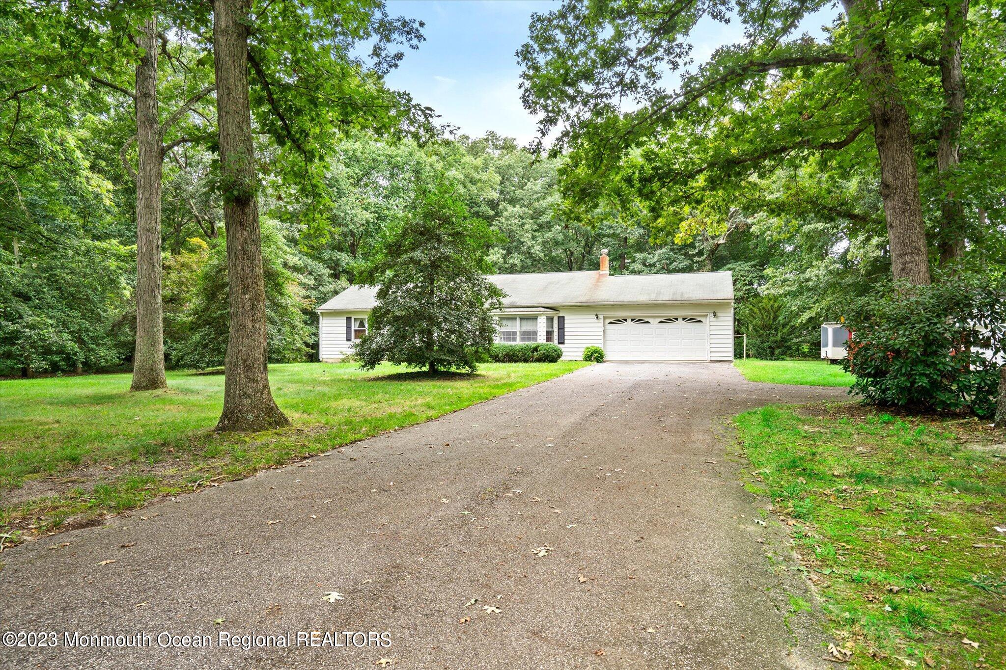 201 West Millstream Road Cream Ridge, NJ 08514 - Photo 7 of 41 a view of a house with backyard and trees