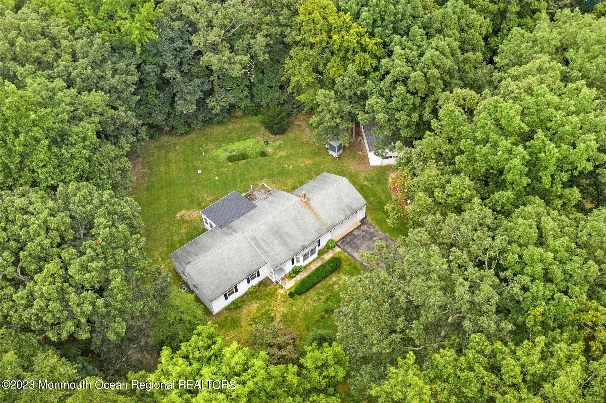 201 West Millstream Road Cream Ridge, NJ 08514 - Photo 8 of 41 an aerial view of a house with a yard basket ball court and outdoor seating