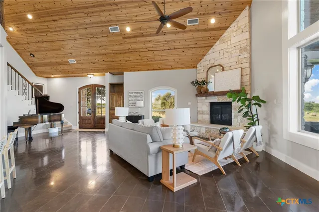 a living room with furniture and a fireplace
