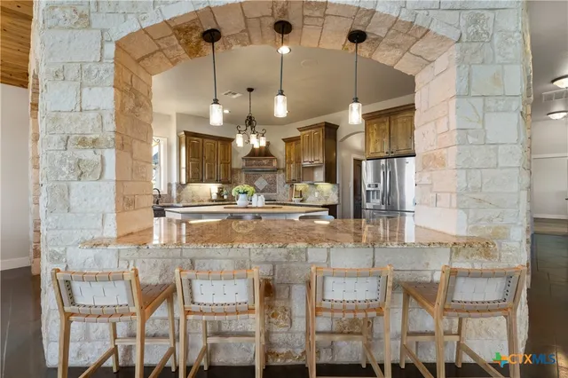 a view of a living room and kitchen