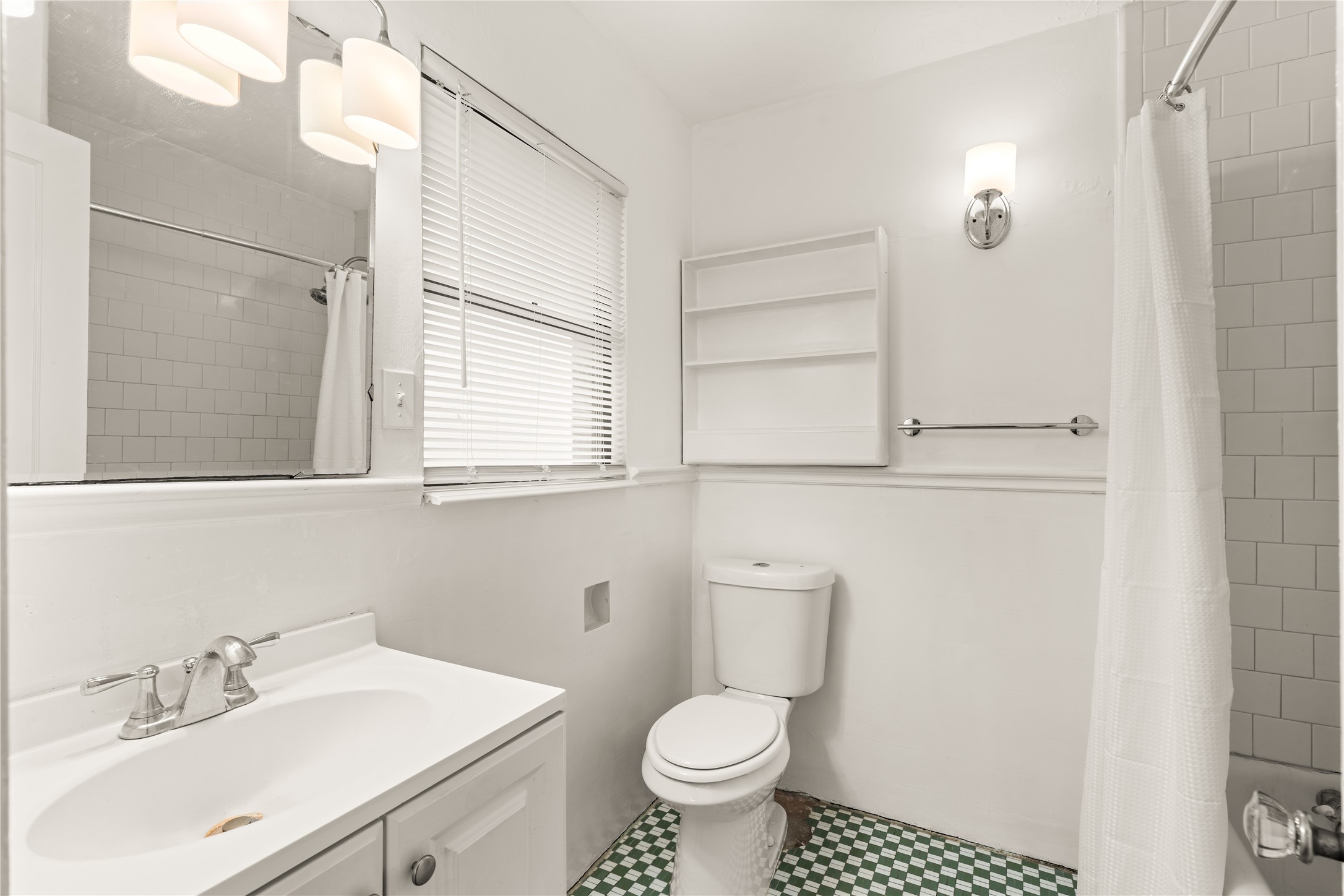 2202 West Main Street Houston, TX 77098 - Photo 22 of 32 a bathroom with a sink toilet and shower