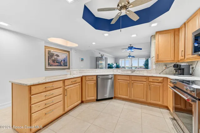 an aerial view of residential house with outdoor space and trees