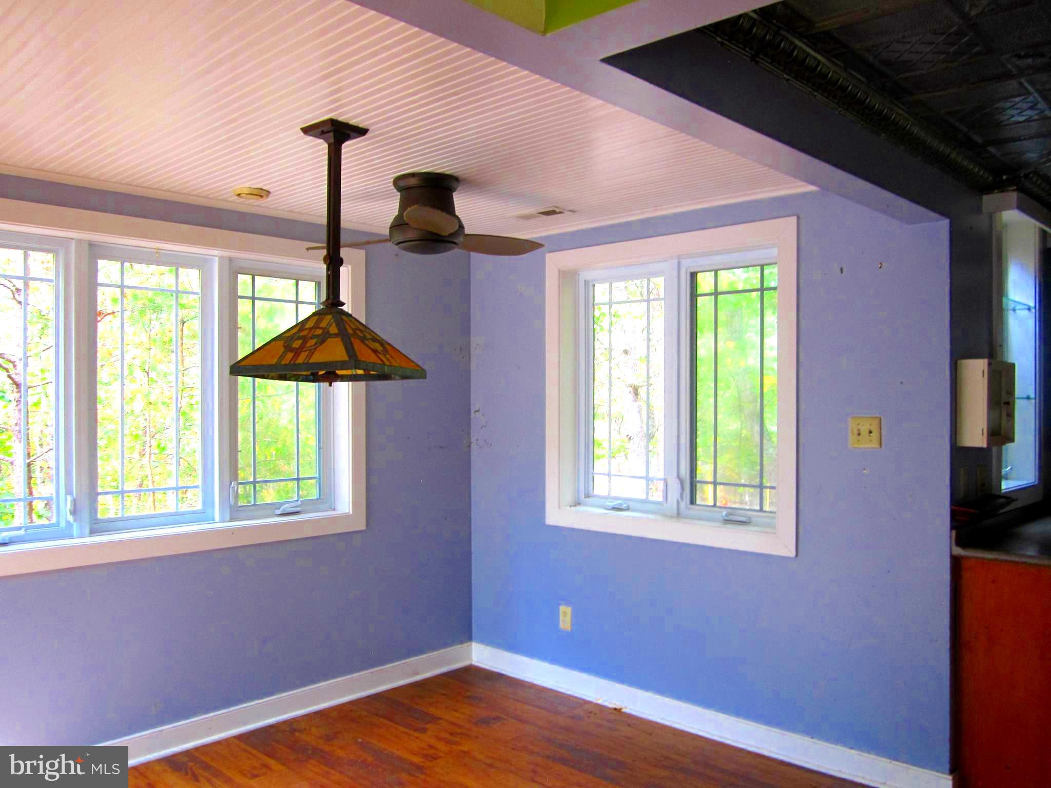 17 Davis Court Basye, VA 22810 - Photo 11 of 18 a view of an empty room with a window and wooden floor