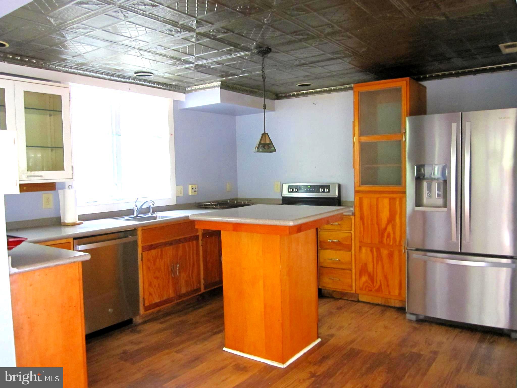 17 Davis Court Basye, VA 22810 - Photo 12 of 18 a kitchen with stainless steel appliances granite countertop a refrigerator a sink and a stove