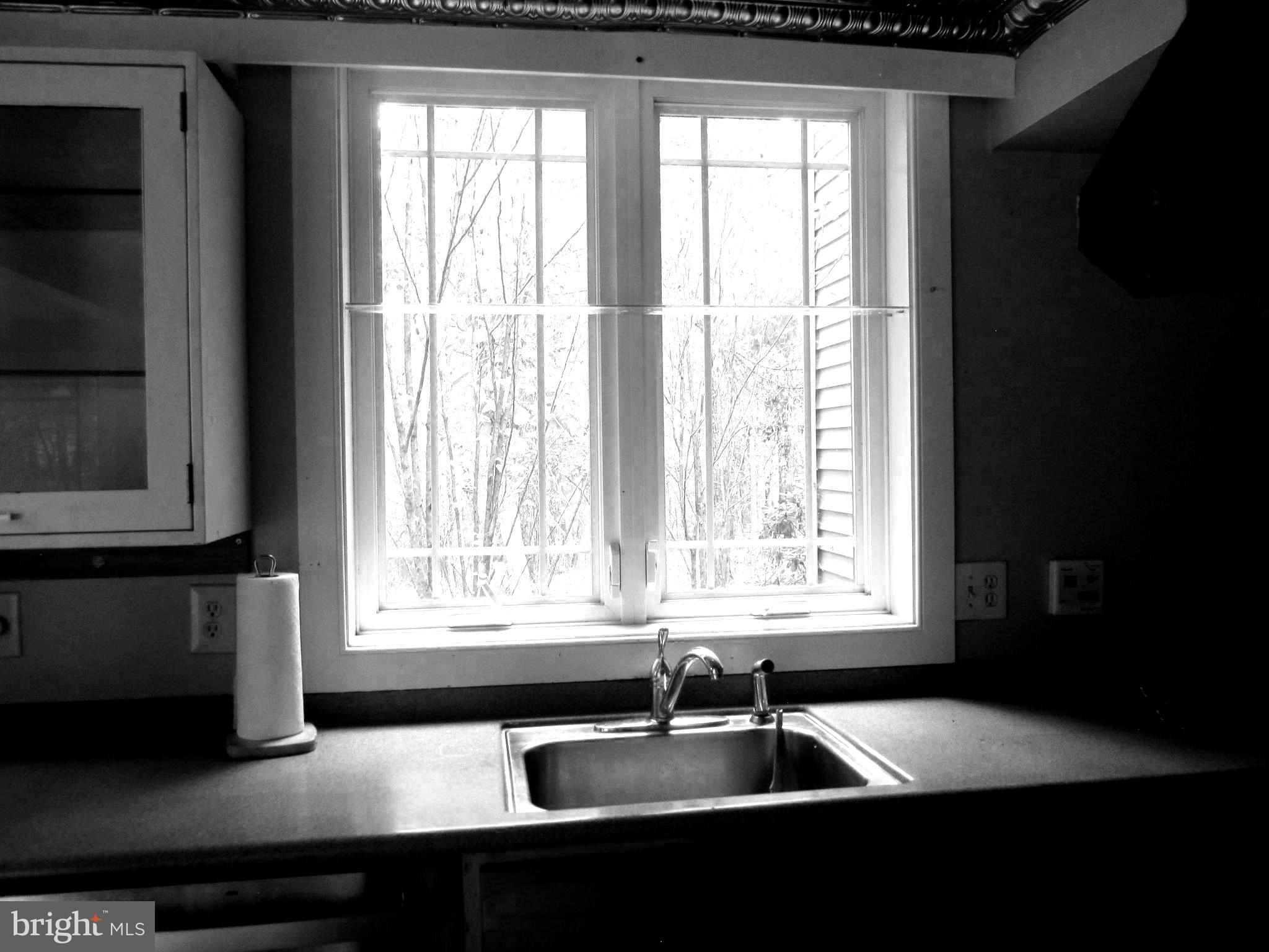 17 Davis Court Basye, VA 22810 - Photo 13 of 18 a kitchen with granite countertop a sink and a window