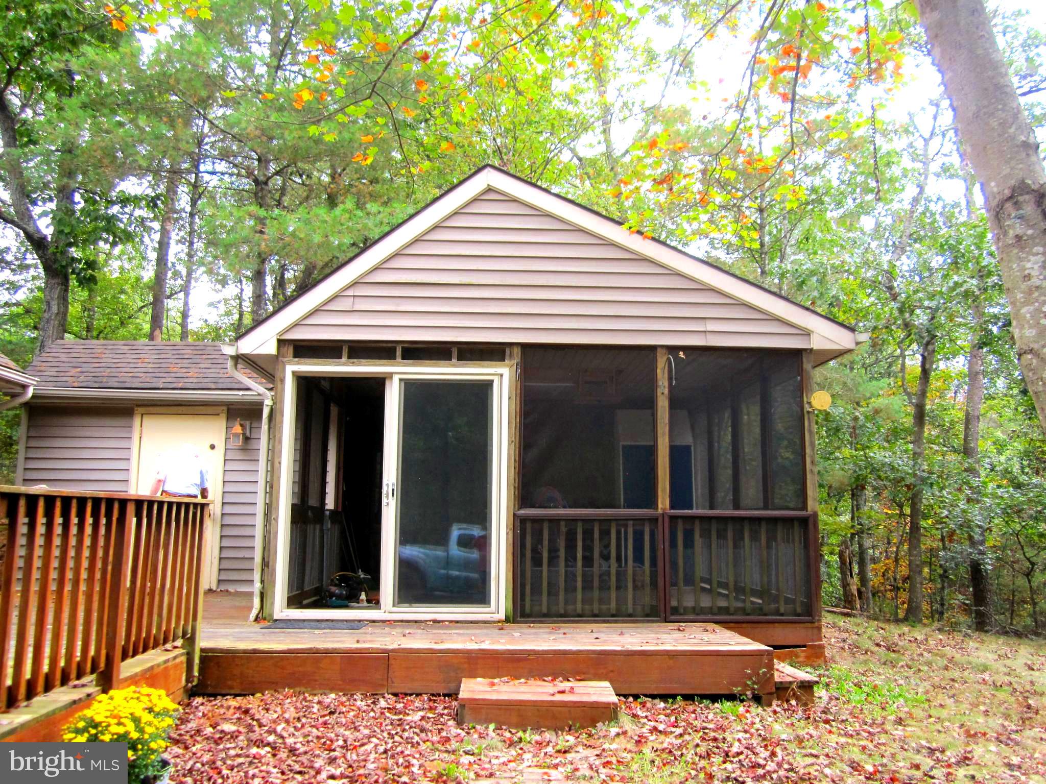 17 Davis Court Basye, VA 22810 - Photo 4 of 18 a view of a house with a small yard and wooden fence