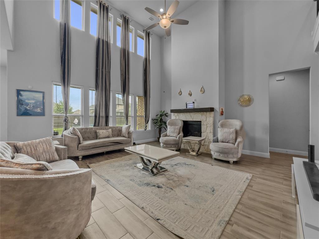 116 Chaco Drive Forney, TX 75126 - Photo 3 of 27 a living room with furniture fireplace and a fireplace