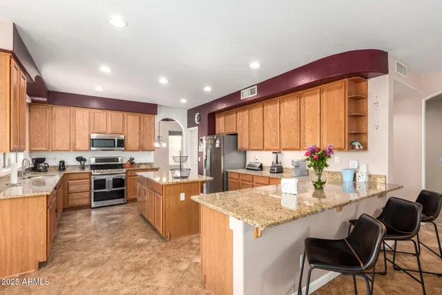 a en suite bathroom with a double sink and mirror