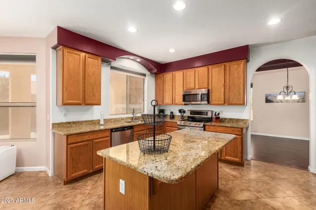 a view of a house with pool and sitting area