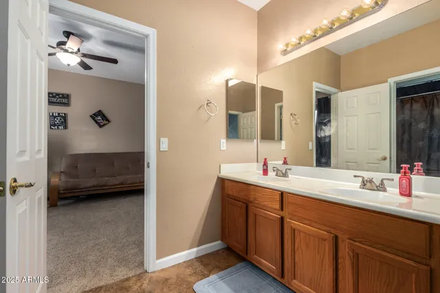 a view of a patio with a table chairs under a umbrella