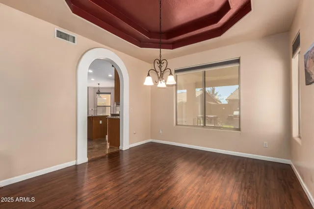 a kitchen with sink a counter top space appliances and cabinets