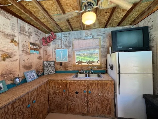 a view of a house with wooden floor and outdoor seating
