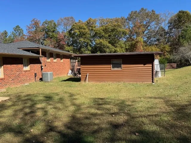 a bedroom with bed and a window