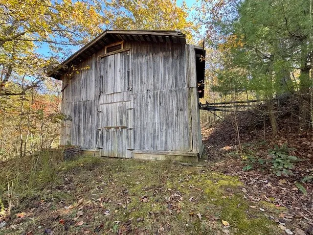 a living room with furniture a window and gym equipment