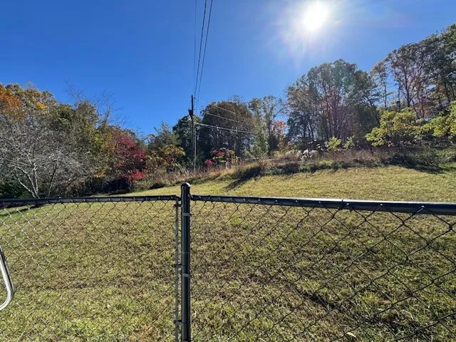 a view of a street with a building in the background