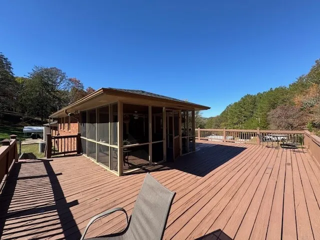 a bathroom with a granite countertop sink and shower