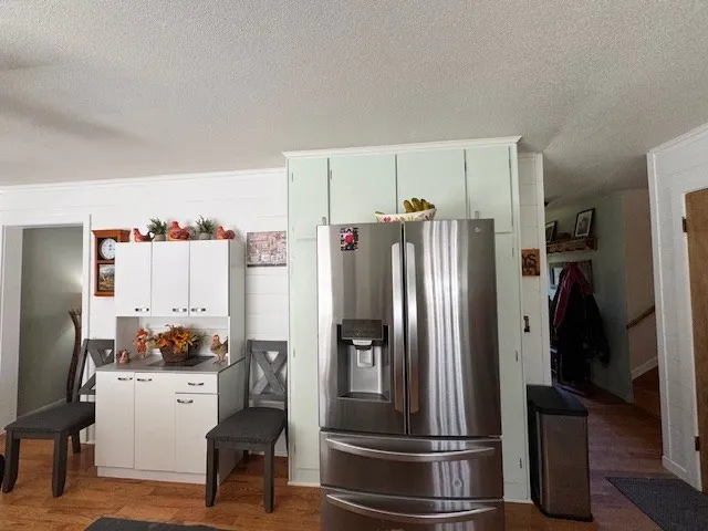 a kitchen with granite countertop a sink a window and stainless steel appliances