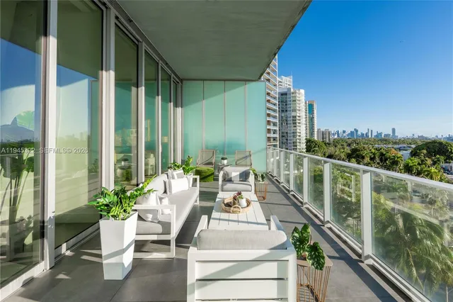a view of balcony with chairs and potted plant