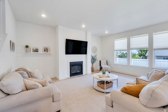 2664 West Maple Street Mapleton, UT 84664 - Photo 11 of 49 Spacious living area featuring a fireplace, recessed lighting, and wood-finish flooring