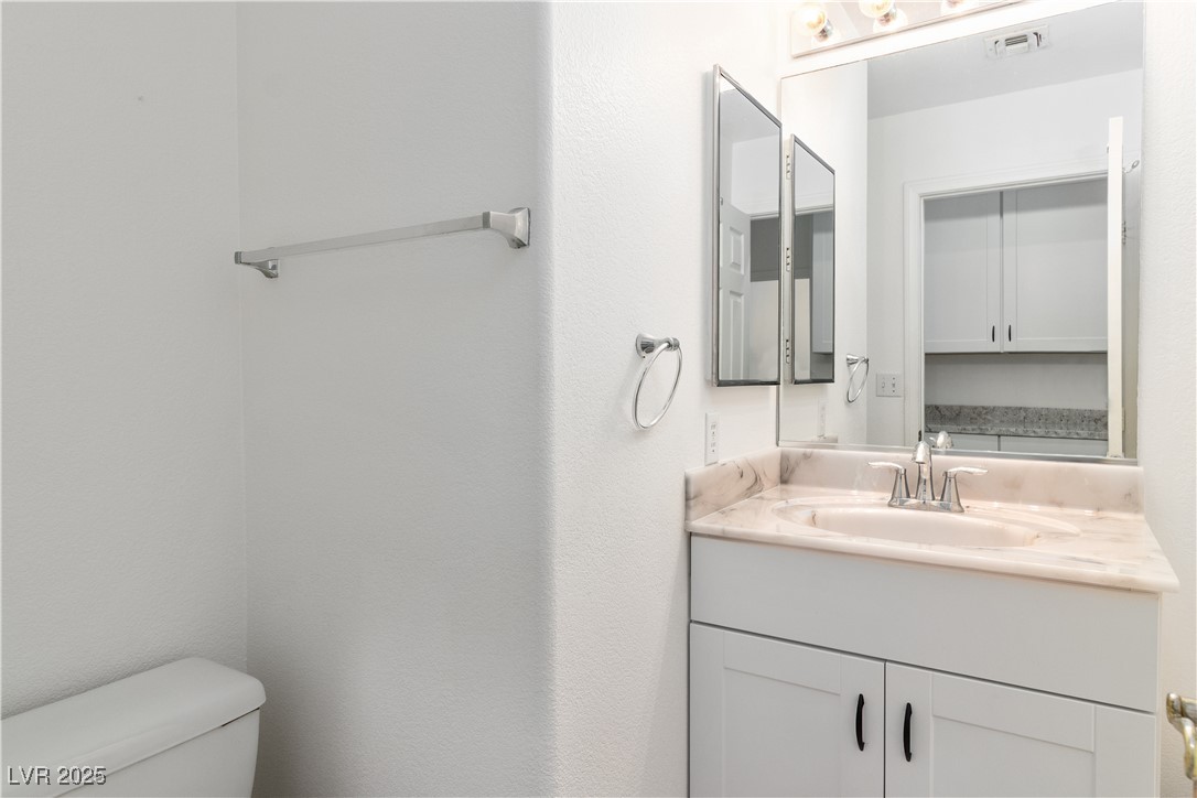 3155 Quail Song Drive Laughlin, NV 89029 - Photo 36 of 85 Bathroom featuring vanity and toilet