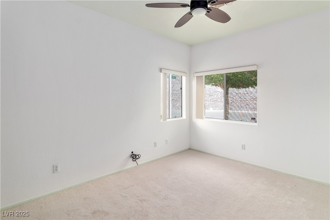 3155 Quail Song Drive Laughlin, NV 89029 - Photo 38 of 85 Third bedroom featuring carpet flooring and ceiling fan