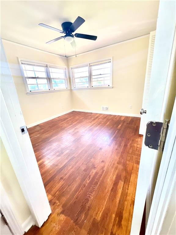119 Fifth Avenue Jonesboro, GA 30236 - Photo 19 of 29 a view of an empty room with wooden floor and a window