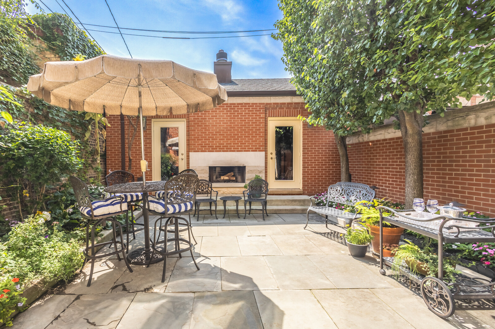 1423 West Lexington Street Chicago, IL 60607 - Photo 13 of 36 a view of a patio with a table and chairs under an umbrella