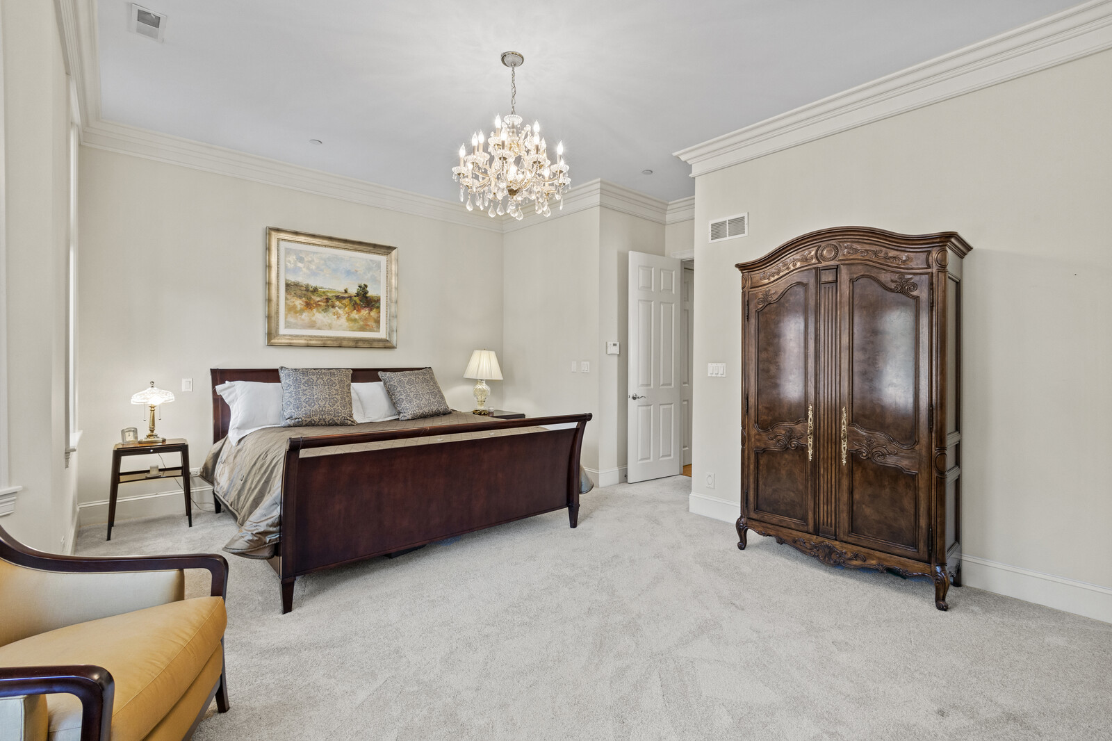 1423 West Lexington Street Chicago, IL 60607 - Photo 20 of 36 a spacious bedroom with a bed and a chandelier