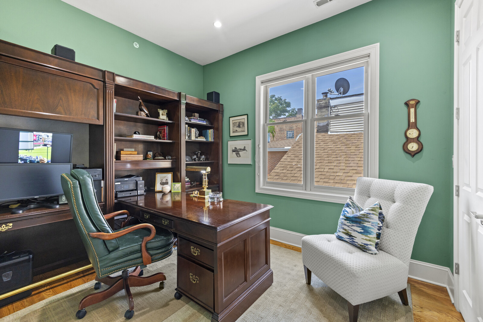 1423 West Lexington Street Chicago, IL 60607 - Photo 28 of 36 a living room with furniture and a book shelf