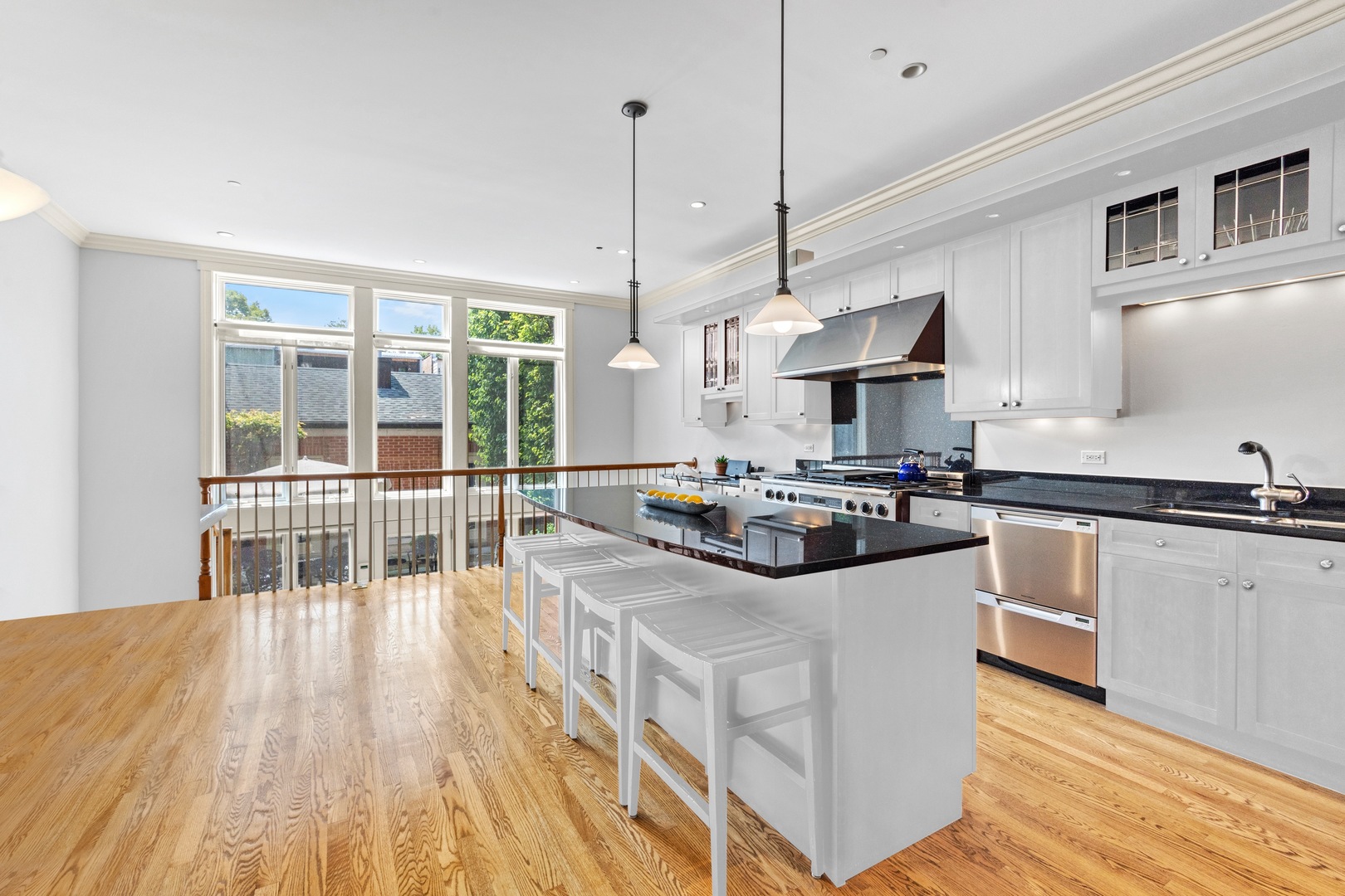 1423 West Lexington Street Chicago, IL 60607 - Photo 8 of 36 a kitchen with stainless steel appliances granite countertop a stove and a wooden floors