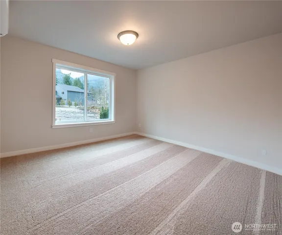 a white toilet sitting next to a wooden cabinet