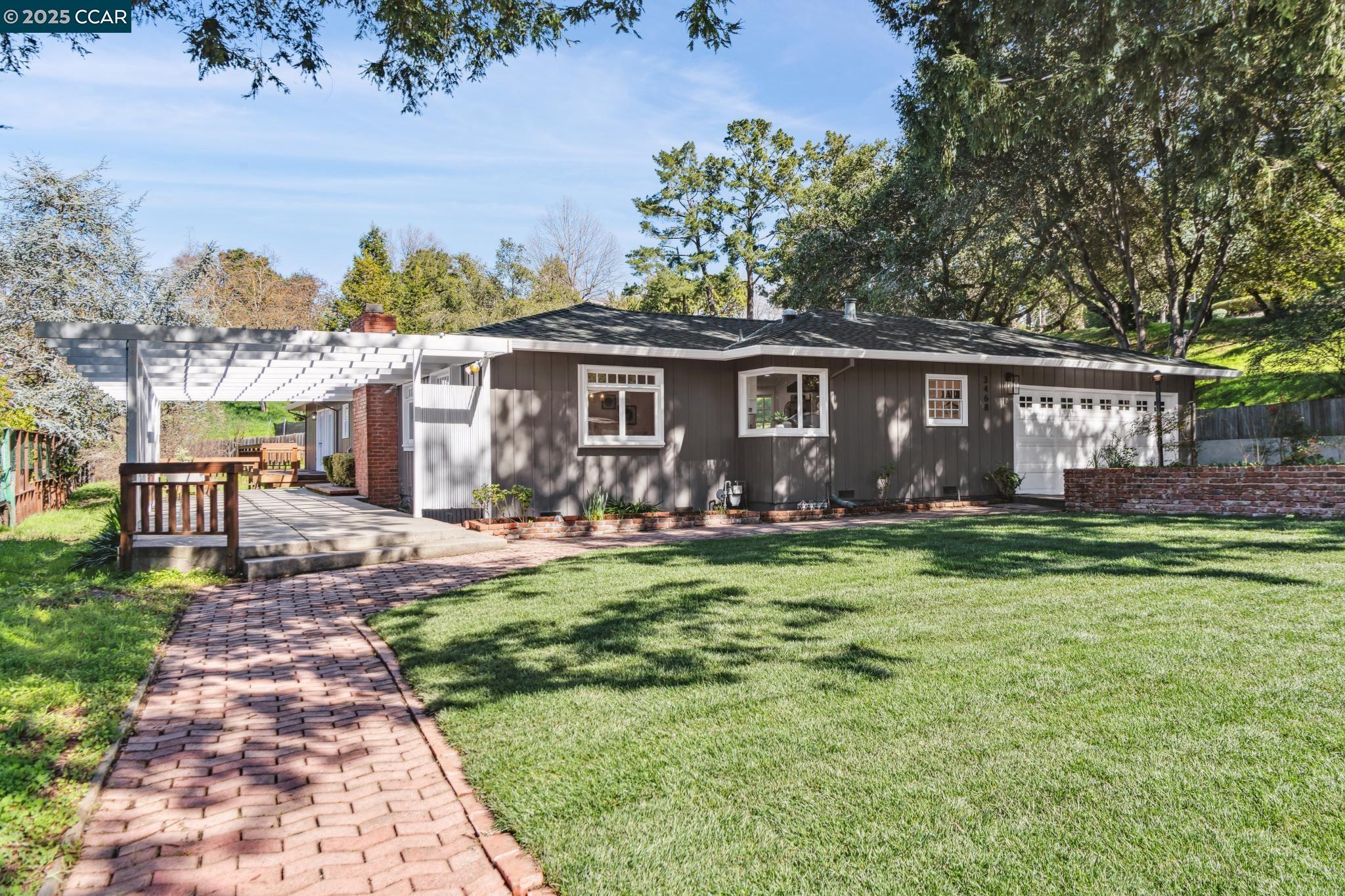 3468 Hamlin Road Lafayette, CA 94549 - Photo 1 of 1 a front view of house with yard and outdoor seating