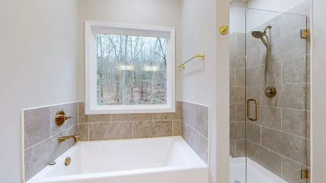 a bathroom with a sink a toilet and bathtub