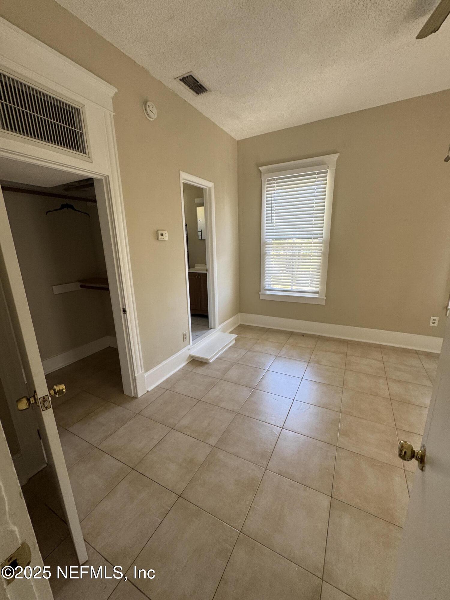 1604 Cherry Street, Unit 4 Jacksonville, FL 32205 - Photo 8 of 11 a view of an empty room with a window
