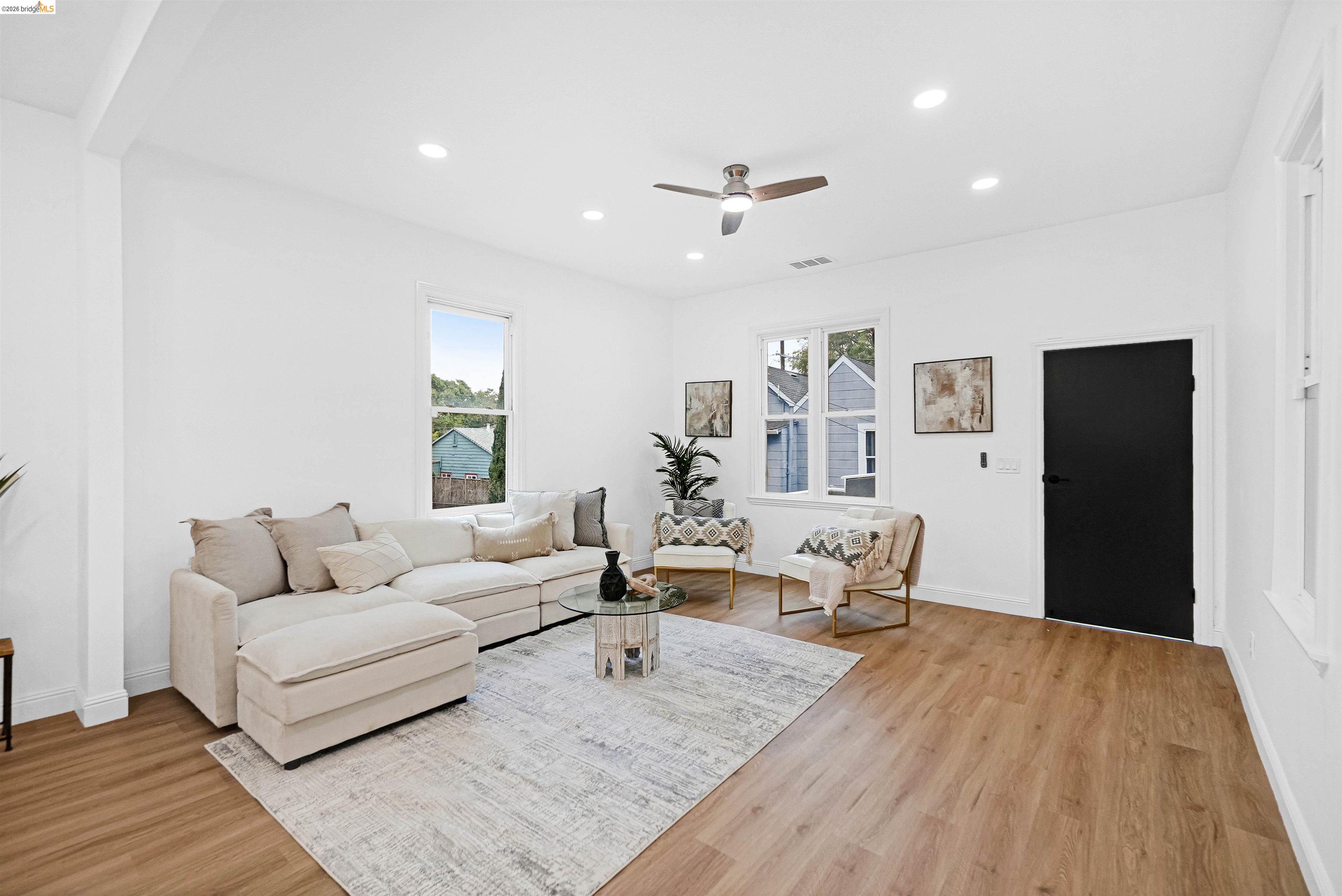 1812 Woolsey Street Berkeley, CA 94703 - Photo 6 of 48 Spacious living area featuring light wood-finish flooring, recessed lighting, and a ceiling fan