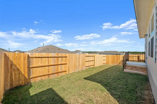 a view of a backyard with a garden