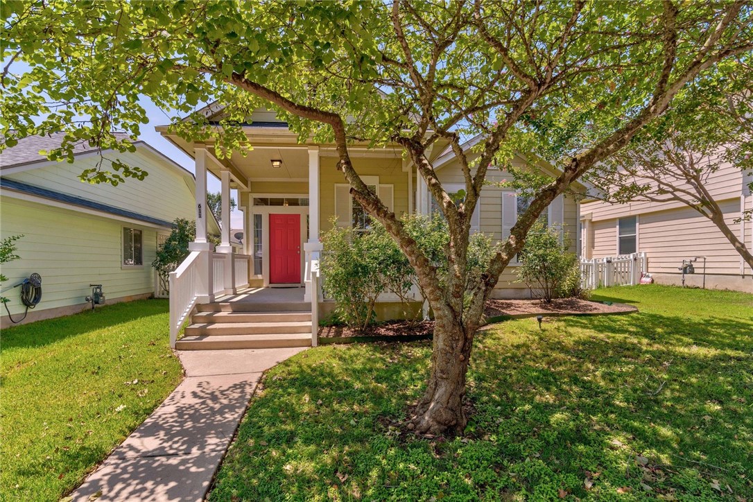 611 Hogan Kyle, TX 78640 - Photo 1 of 1 a front view of a house with garden