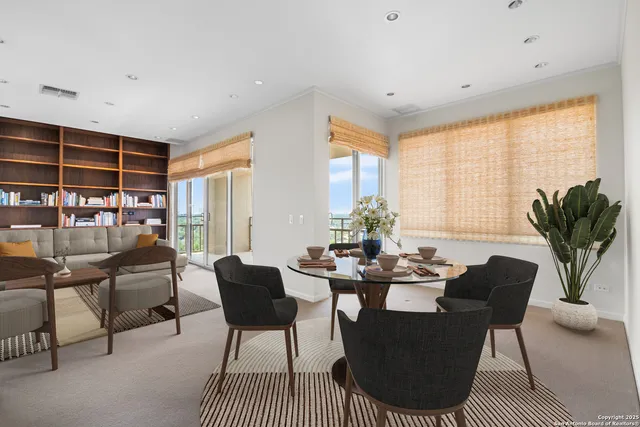 a dining room with furniture and window