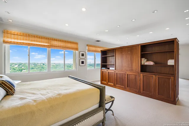 a bed room with a bed and a television