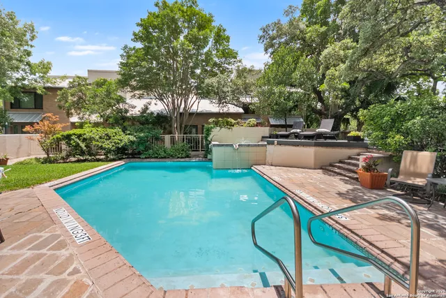 a view of a backyard with sitting area