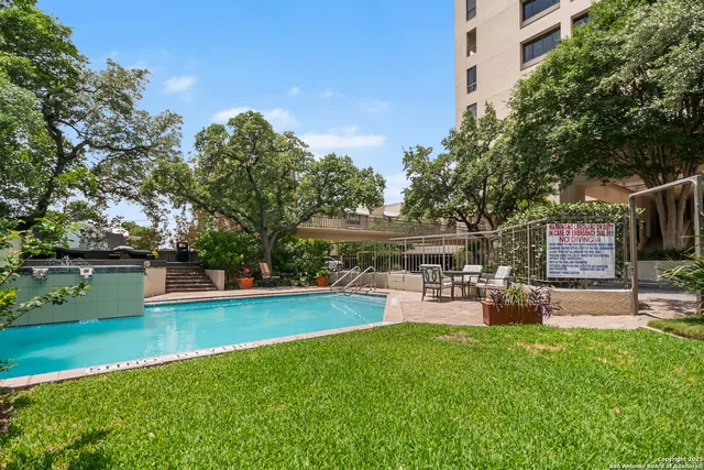 a view of a backyard with sitting area