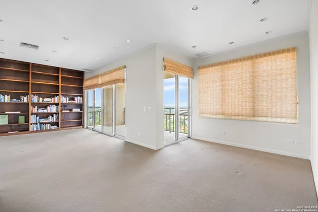 a view of an empty room with shelves