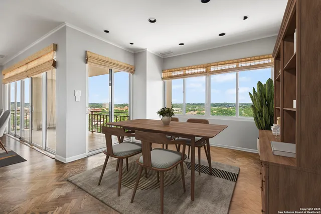 a view of a dining room with furniture window and wooden floor