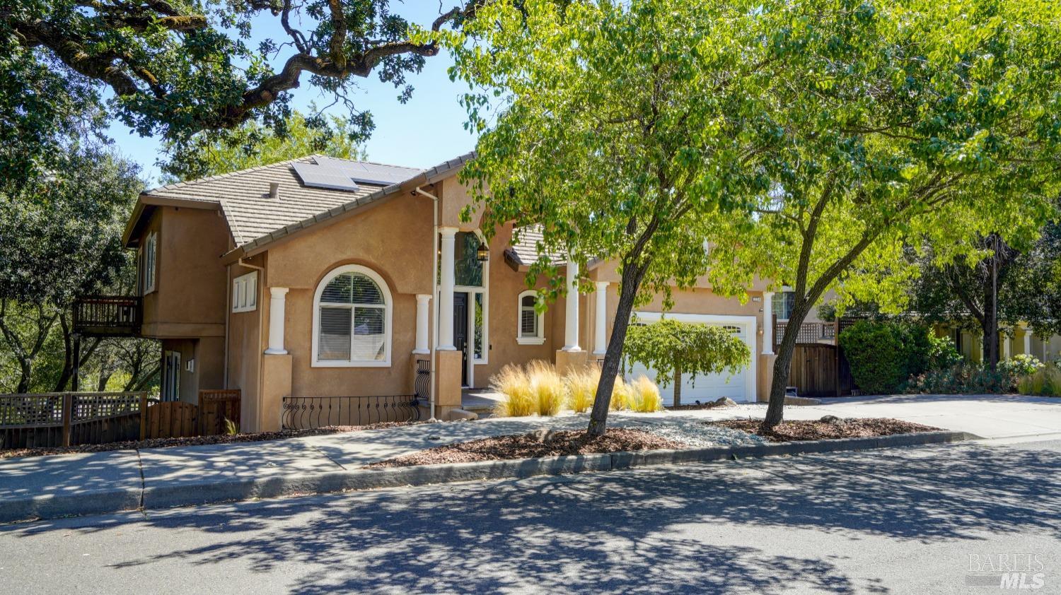 a view of a house with yard and tree s