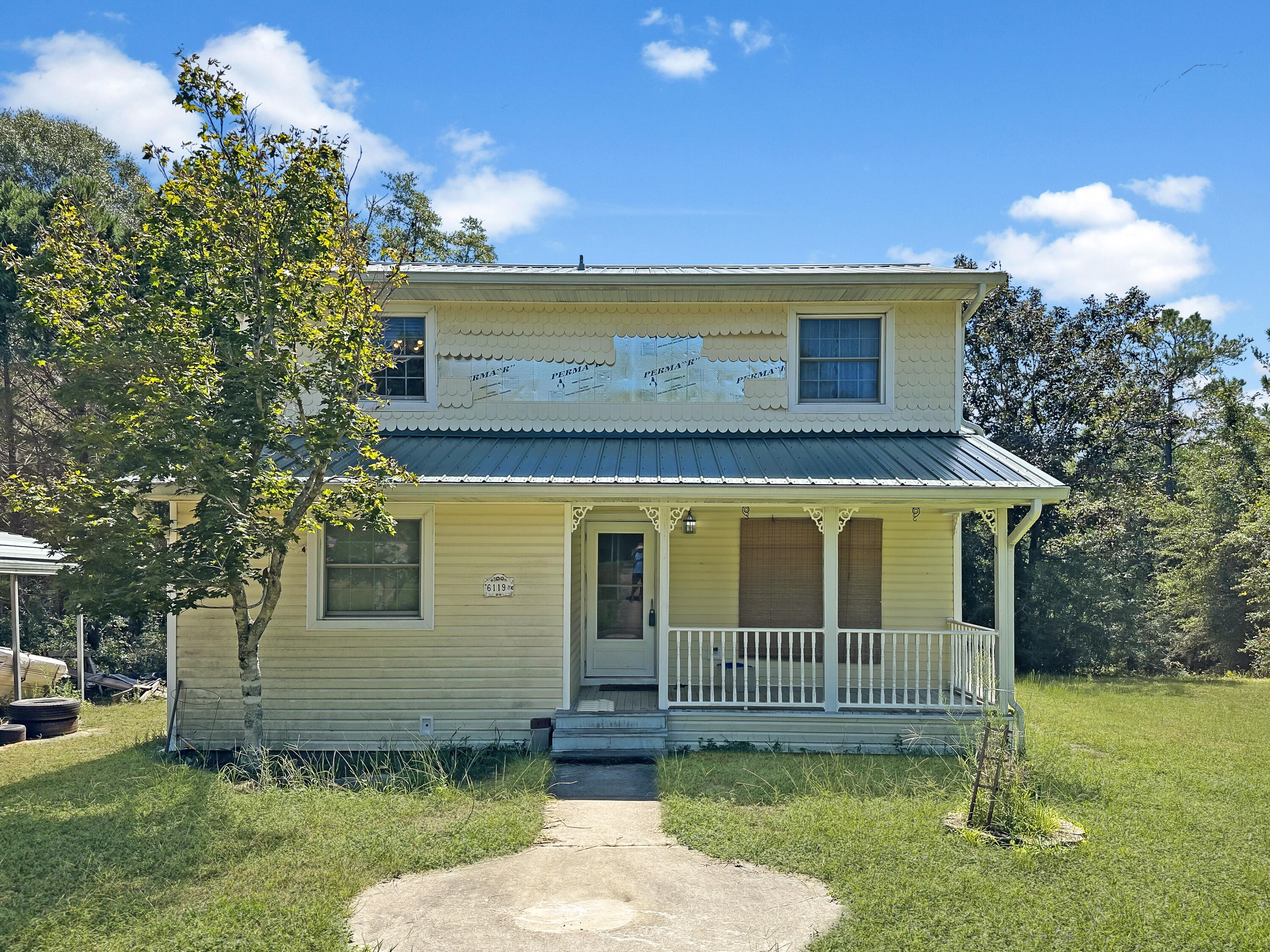 6119 Clear Creek Road Crestview, FL 32539 - Photo 1 of 46 a view of a house with a yard